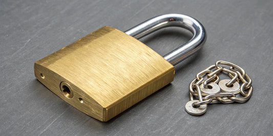A heavy duty brass padlock with a thick shackle, featured in our best padlock reviews.