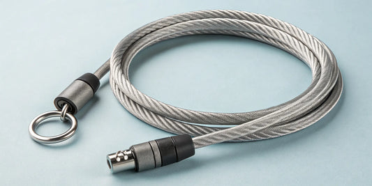 A coiled braided steel cable lock with its secure locking mechanism.