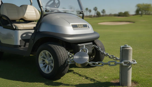 A sleek modern golf cart secured with a heavy-duty steel lock on a golf course