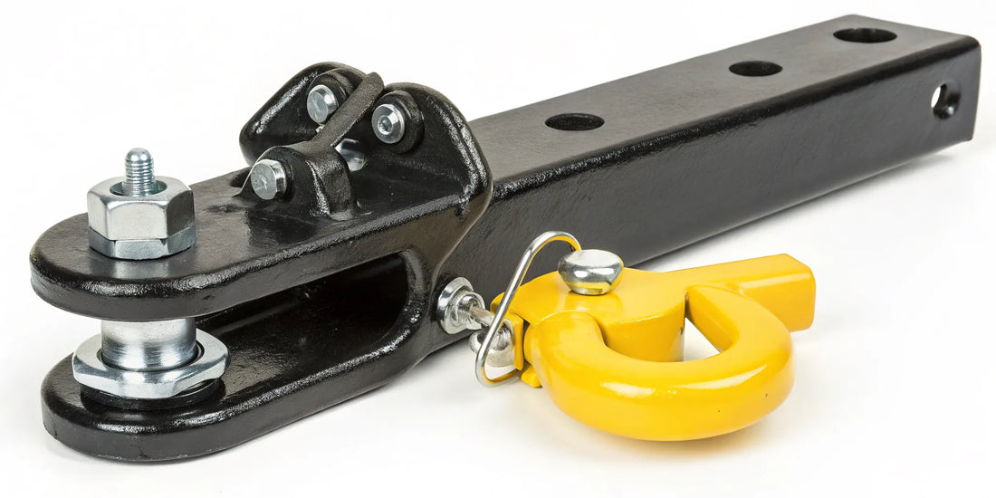 A heavy-duty yellow coupler lock securing a trailer hitch to prevent theft.