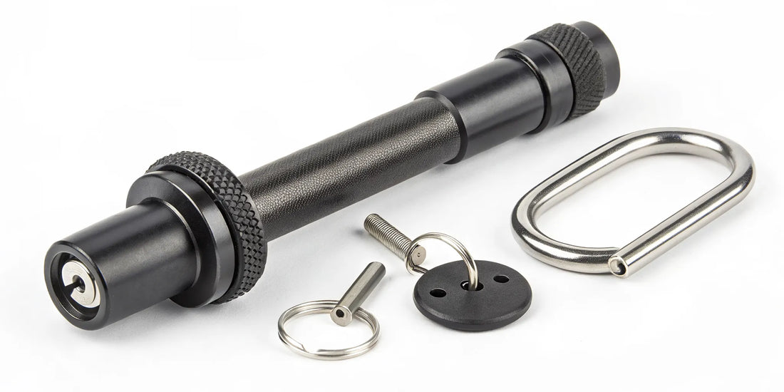 A locking hitch pin with keys secures a trailer hitch and prevents theft.