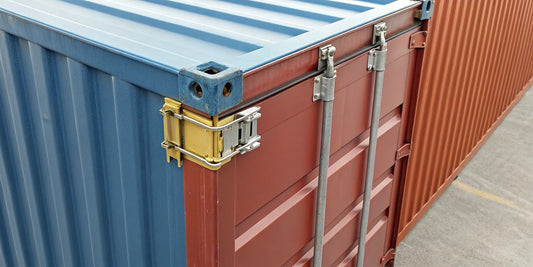 A shipping container lock for stacking, secured in the corner casting.